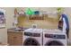 Laundry room featuring new large capacity washer and dryer units at 19 Lindley Nw Ave, Marietta, GA 30064
