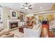 Cozy living room with a fireplace, built-in bookshelves, hardwood floors, and comfortable seating at 19 Lindley Nw Ave, Marietta, GA 30064