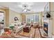 Elegant living room featuring a fireplace, hardwood floors, and plantation shutters at 19 Lindley Nw Ave, Marietta, GA 30064