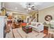 Spacious living room showcasing hardwood floors, a fireplace, and open access to the dining area at 19 Lindley Nw Ave, Marietta, GA 30064