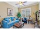Comfortable living room with blue furniture, ceiling fan and many windows at 19 Lindley Nw Ave, Marietta, GA 30064