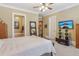 Serene main bedroom features soft lighting and a TV at 19 Lindley Nw Ave, Marietta, GA 30064