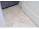 Chic half-bath featuring patterned hexagon tile flooring at 220 Alcovy Terrace, Alpharetta, GA 30009