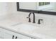 Bathroom vanity with marble countertop, black faucet, and dark hardware at 220 Alcovy Terrace, Alpharetta, GA 30009