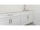 Bathroom vanity with white marble countertop, stainless steel fixtures, and white cabinets at 220 Alcovy Terrace, Alpharetta, GA 30009