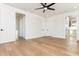 Bedroom with hardwood floors, and multiple doors leading to various rooms at 220 Alcovy Terrace, Alpharetta, GA 30009