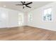 Spacious bedroom with hardwood floors, crown molding, and bright natural light from the windows at 220 Alcovy Terrace, Alpharetta, GA 30009
