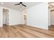 Spacious bedroom with hardwood floors, a ceiling fan, and multiple entryways at 220 Alcovy Terrace, Alpharetta, GA 30009