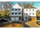 New construction featuring two-car garages and stone accents at 220 Alcovy Terrace, Alpharetta, GA 30009