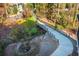The property boasts a scenic walking bridge amidst a wooded area at 220 Alcovy Terrace, Alpharetta, GA 30009