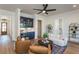 Sitting area with built-in blue bar and hardwood floors at 220 Alcovy Terrace, Alpharetta, GA 30009