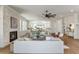 Expansive living room showcasing fireplace, large windows, and open flow to kitchen and dining spaces at 220 Alcovy Terrace, Alpharetta, GA 30009