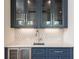 Wet bar with marble counter tops and mosaic tile backsplash at 220 Alcovy Terrace, Alpharetta, GA 30009