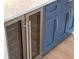 Wet bar with built-in mini fridge and shaker cabinets at 220 Alcovy Terrace, Alpharetta, GA 30009