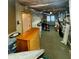Cluttered basement with a vintage wooden dresser and exposed plumbing at 560 Hunt River Way, Suwanee, GA 30024
