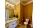 Bathroom with toilet, tile flooring, neutral colored walls, and marble countertop at 560 Hunt River Way, Suwanee, GA 30024