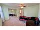 Bedroom with mirror sliding closet doors, neutral carpet, and ceiling fan at 560 Hunt River Way, Suwanee, GA 30024