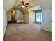 Large bonus room featuring built-in shelving, neutral tones, and plush carpeting at 560 Hunt River Way, Suwanee, GA 30024