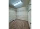 Walk-in closet with carpeted floor and wire shelving at 560 Hunt River Way, Suwanee, GA 30024