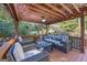 Comfortable, covered deck area with casual seating and ceiling fan at 560 Hunt River Way, Suwanee, GA 30024