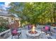 Backyard stone firepit with seating, perfect for outdoor entertaining at 560 Hunt River Way, Suwanee, GA 30024