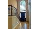 Grand foyer with soaring ceilings, beautiful staircase, and hardwood floors, creating a welcoming entrance at 560 Hunt River Way, Suwanee, GA 30024