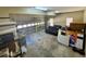 Messy two car garage with some stored items and a rolling garage door at 560 Hunt River Way, Suwanee, GA 30024