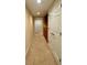 Hallway featuring built-in cabinets, neutral walls, and plush carpeting at 560 Hunt River Way, Suwanee, GA 30024