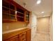 Hallway featuring built-in cabinets, neutral walls, and plush carpeting at 560 Hunt River Way, Suwanee, GA 30024