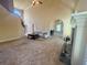 Spacious living room featuring fireplace, carpeted floors and great natural light at 560 Hunt River Way, Suwanee, GA 30024