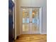Elegant living room with decorative glass French doors and hardwood flooring at 560 Hunt River Way, Suwanee, GA 30024