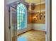Bright living room featuring large windows, wainscoting, and elegant lighting, highlighting the space's ambiance at 560 Hunt River Way, Suwanee, GA 30024