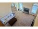 Open living space with fireplace and large windows, offering ample natural light at 560 Hunt River Way, Suwanee, GA 30024