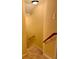 Carpeted staircase with wooden handrail and light yellow walls at 560 Hunt River Way, Suwanee, GA 30024