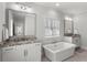 Bright bathroom with double vanities and luxurious soaking tub at 914 Martin Nw St, Atlanta, GA 30318