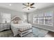 Bright bedroom with ceiling fan, plush bedding, and large windows create a serene retreat at 914 Martin Nw St, Atlanta, GA 30318