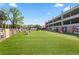 Spacious dog park with lush green turf, seating areas, and fencing for a secure play environment at 914 Martin Nw St, Atlanta, GA 30318