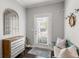 Charming entryway with a decorative mirror, console table, bench, and a door with a window at 914 Martin Nw St, Atlanta, GA 30318