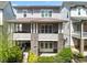 Elegant townhome with covered porch, double doors, and beautiful landscaping at 914 Martin Nw St, Atlanta, GA 30318