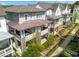 Aerial view of elegant townhomes featuring covered porches, stone accents, and manicured landscaping at 914 Martin Nw St, Atlanta, GA 30318
