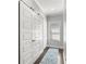 Bright hallway featuring white doors, natural light, and an elegant blue patterned runner rug at 914 Martin Nw St, Atlanta, GA 30318