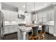 Gourmet kitchen featuring granite countertops, stainless steel appliances, and a central island with seating at 914 Martin Nw St, Atlanta, GA 30318