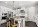 Modern kitchen featuring stainless steel appliances, sleek cabinetry, and a functional center island at 914 Martin Nw St, Atlanta, GA 30318