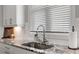 Granite counters with stainless steel sink and modern faucet under bright window at 914 Martin Nw St, Atlanta, GA 30318