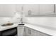 Bright kitchenette includes white cabinets, modern fixtures, and ample counter space at 914 Martin Nw St, Atlanta, GA 30318