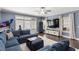 Inviting living room with comfortable sectional, large TV, and plenty of natural light at 914 Martin Nw St, Atlanta, GA 30318