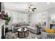 Comfortable living room with a large corner sectional, fireplace, and abundant natural light at 914 Martin Nw St, Atlanta, GA 30318
