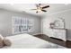 Bright main bedroom boasts beautiful dark wood floors and a lovely white dresser at 914 Martin Nw St, Atlanta, GA 30318