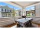A covered porch with a dining table offering an outdoor living space to enjoy the neighborhood views at 914 Martin Nw St, Atlanta, GA 30318
