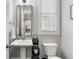 Elegant powder room featuring a pedestal sink, and natural light at 914 Martin Nw St, Atlanta, GA 30318